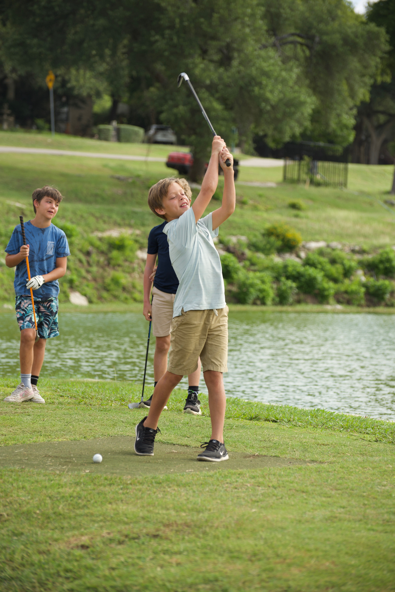 Kids on the range during a Beyond Golf Performance after-school golf academy session in Austin
