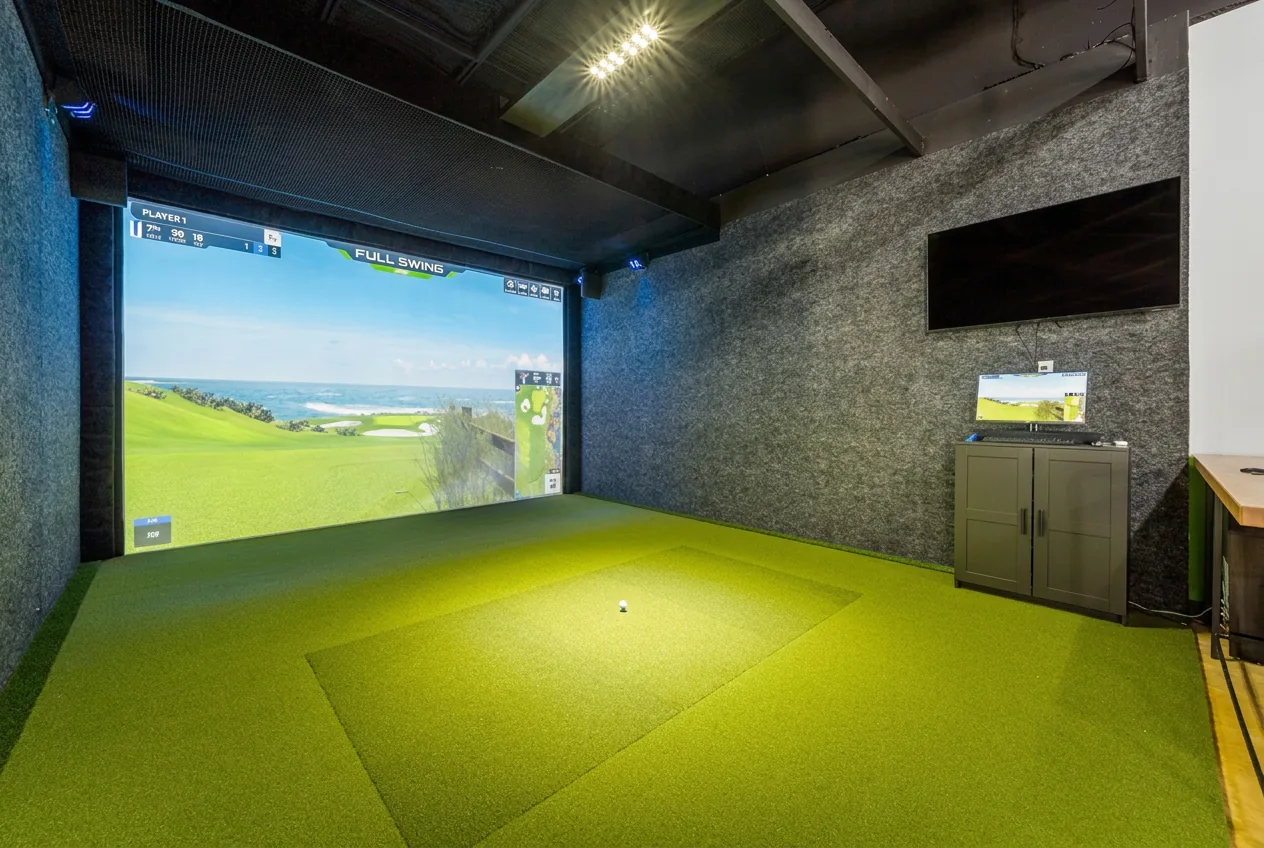Full Swing simulator bay with putting turf at The Back Nine Cedar Park